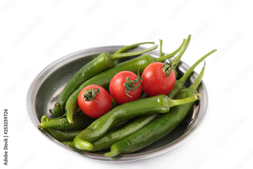 tomato and green pepper on white background tomato and green pepper on white background