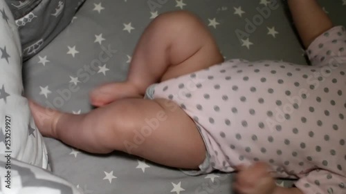 Newborn baby. Little baby. Child. Adorable baby girl. Baby in crib. Baby in bed