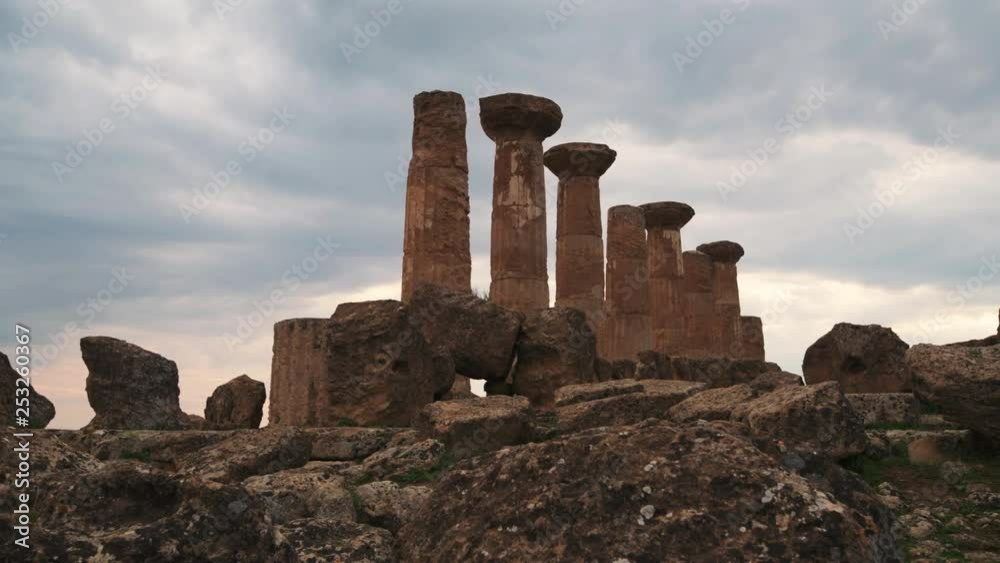 Panning view of Greek temple of Juno in the valley of temples in Sicily at sunset Panning view of Greek temple of Juno in the valley of temples in Sicily at sunset