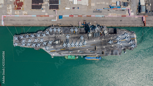 Navy Nuclear Aircraft carrier, Military navy ship carrier full loading fighter jet aircraft, Aerial view. photo