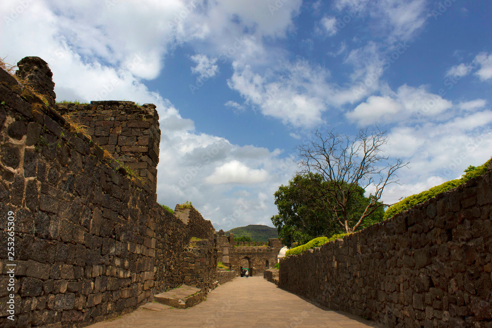 Daulatabad Deogiri fort wall with clouds in background, Aurangabad, Maharashtra, India.