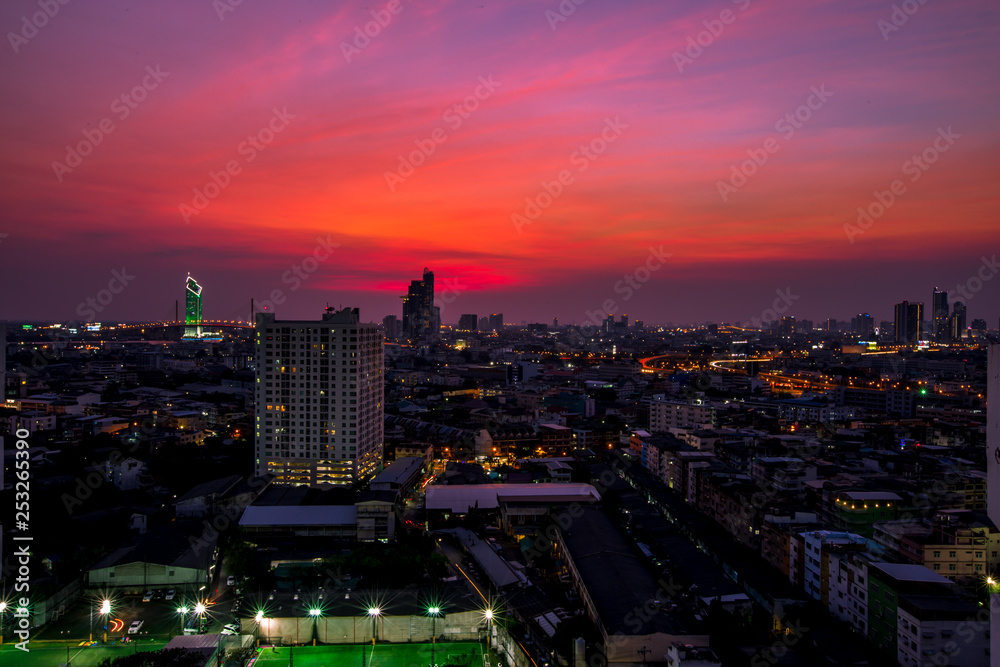 The background of the high angle view in the evening, overlooking the condominium that is under construction in a variety of heights, showing the habitat of the capital city.