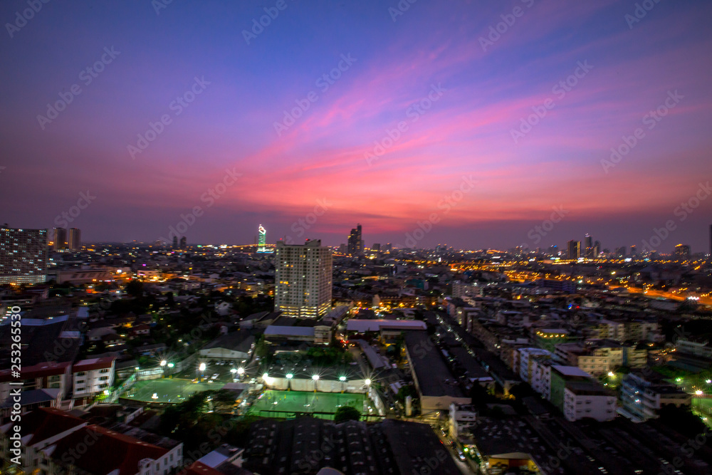The background of the high angle view in the evening, overlooking the condominium that is under construction in a variety of heights, showing the habitat of the capital city.