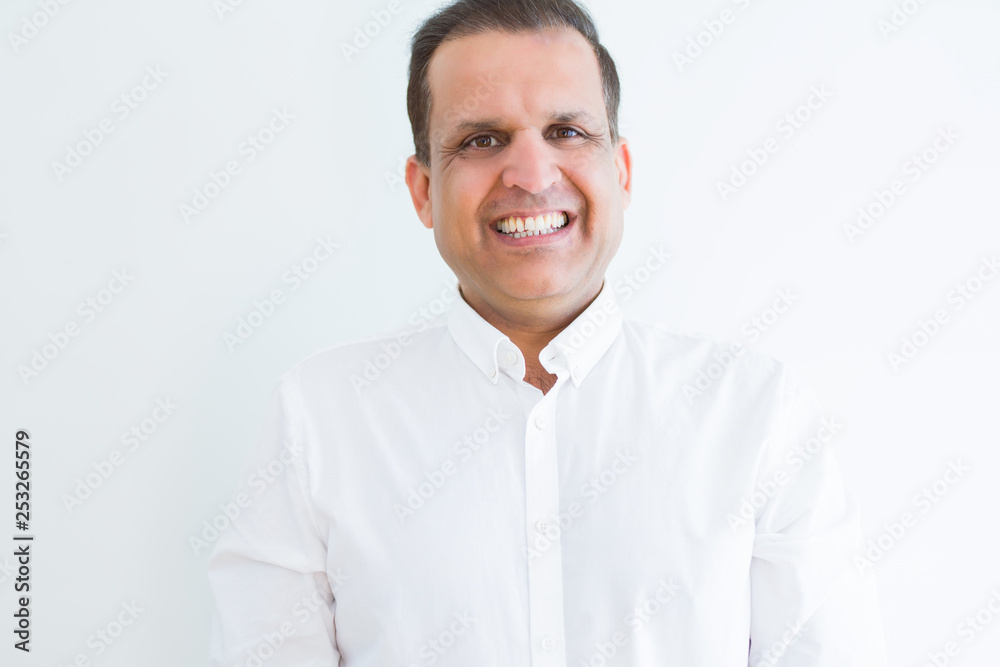 Middle age man smiling confident to the camera at home Middle age man smiling confident to the camera at home