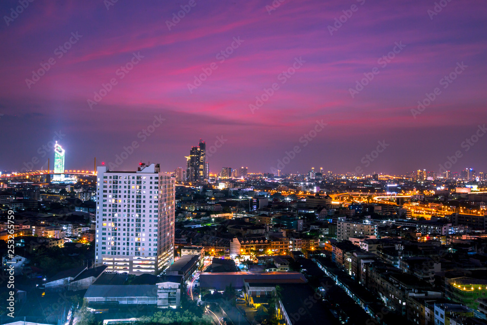 The background of the high angle view in the evening, overlooking the condominium that is under construction in a variety of heights, showing the habitat of the capital city.