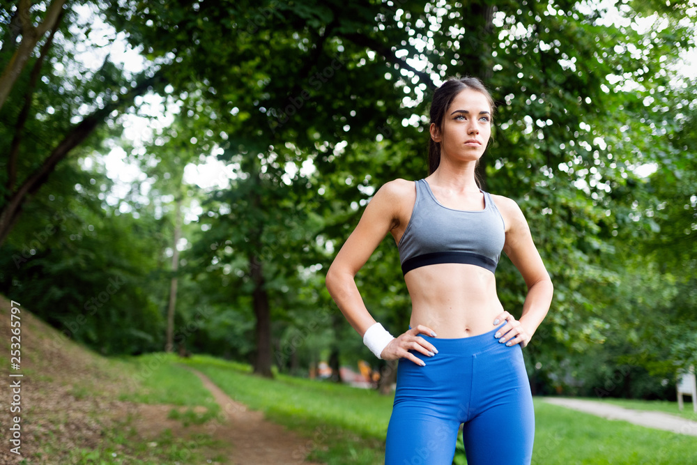 Portrait of athletic woman resting after running in nature Portrait of athletic woman resting after running in nature