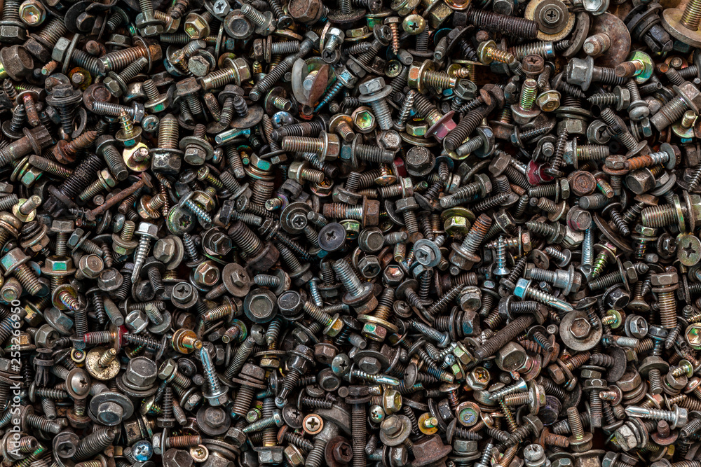 Flat Lay metal fasteners: vinitics, screws, nuts, nails, interchangeable heads, top view. Close-up Carpenter's Tool Kit Flat Lay metal fasteners: vinitics, screws, nuts, nails, interchangeable heads, top view. Close-up Carpenter's Tool Kit