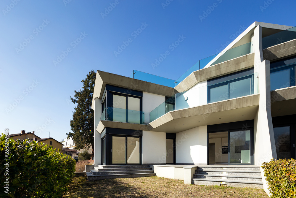 Exterior villa with garden and hedge