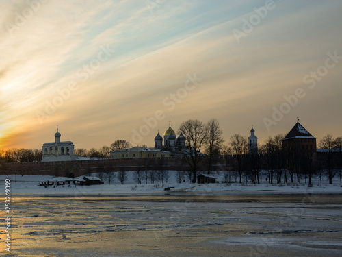 Novgorod Kremlin against the sunset sky. Urban winter landscape