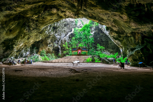 The background of the building inside the cave (Phraya Mahanakon) is beautiful and there is a light shining down, tourists and travelers always visit the beauty.  photo