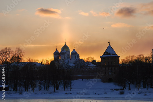 Novgorod Kremlin against the sunset sky. Urban winter landscape