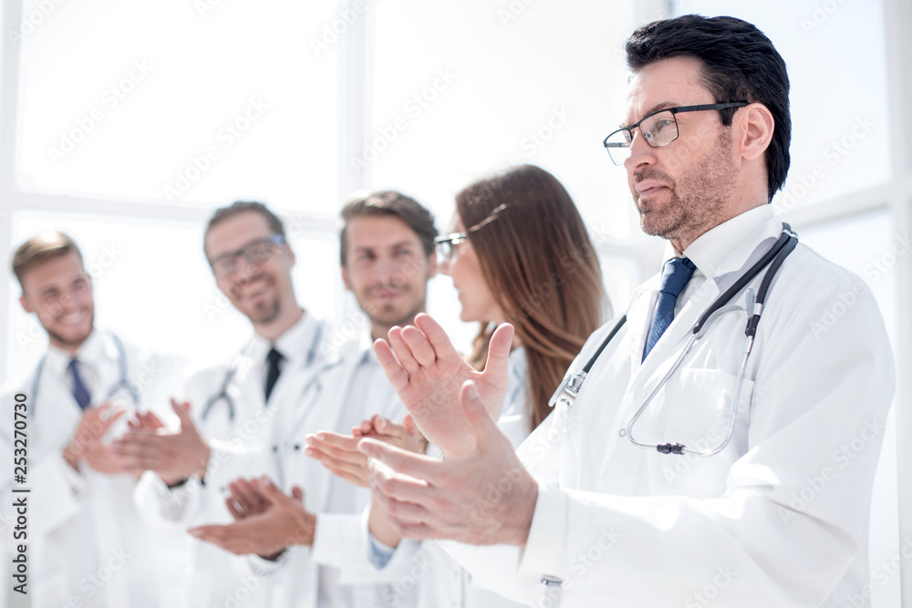 group of doctors applauds, standing in the hospital group of doctors applauds, standing in the hospital