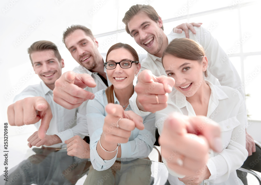 close up.smiling business team pointing at you close up.smiling business team pointing at you