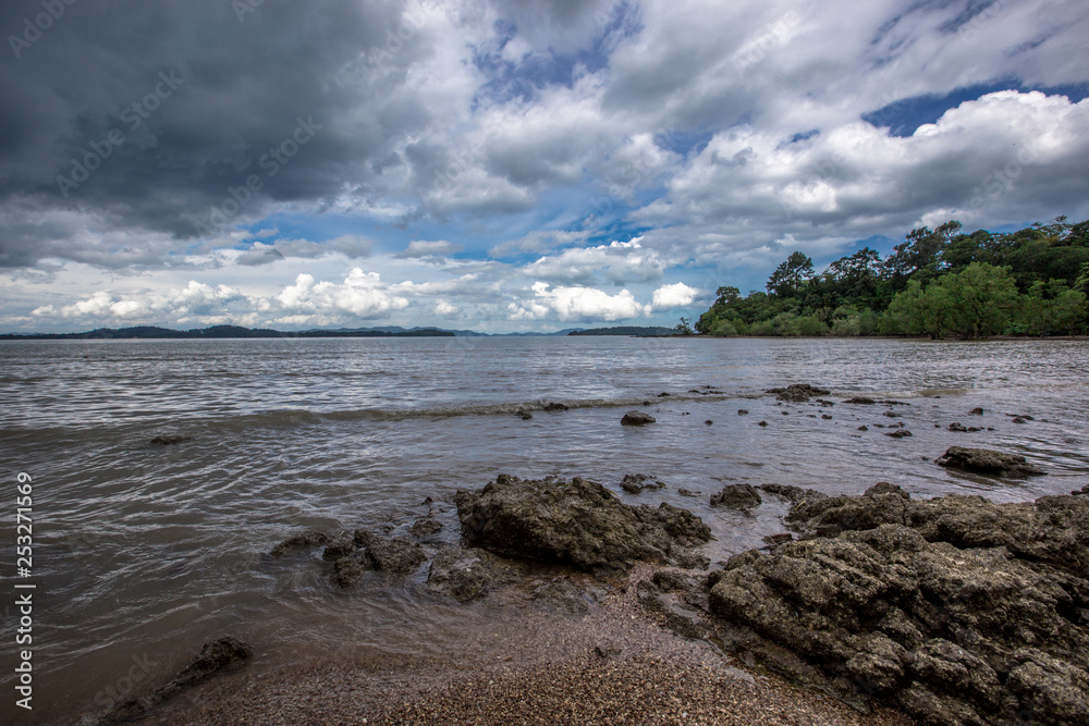 The background of a cloudy sky, colorful like a storm, and rain later, with blurring of wind and sea together, is a phenomenon that occurs naturally.