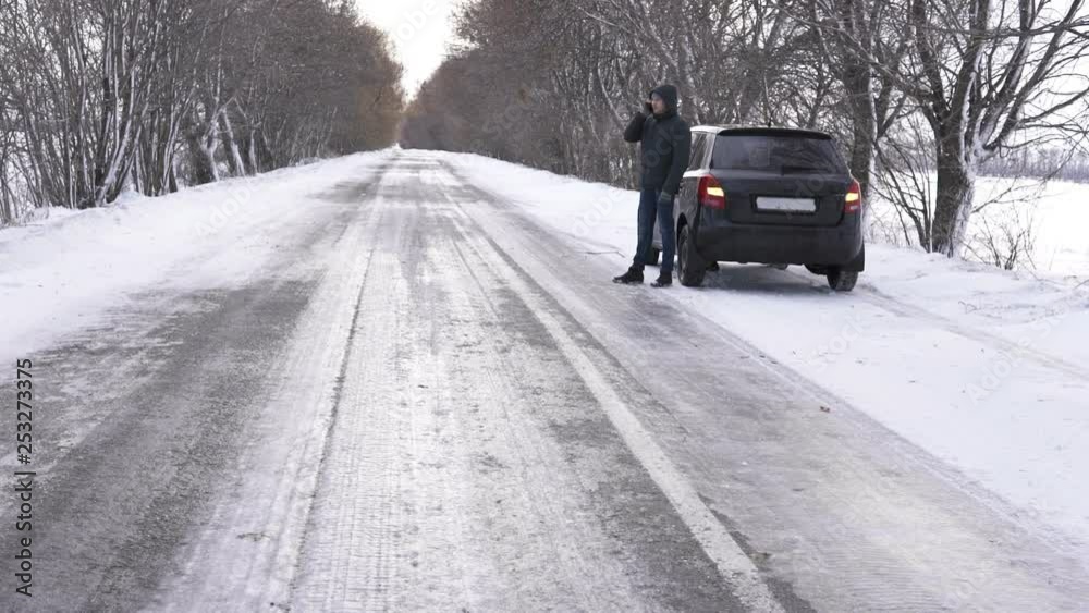 Man using smartphone and calling for help because his car is broken Man using smartphone and calling for help because his car is broken