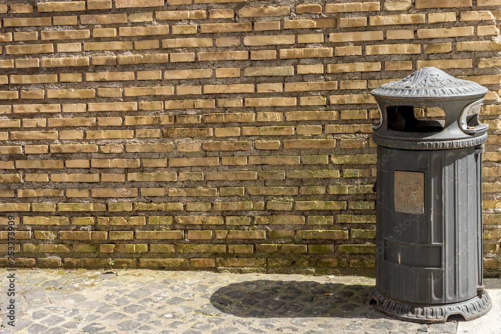red brick wall with garbage can red brick wall with garbage can