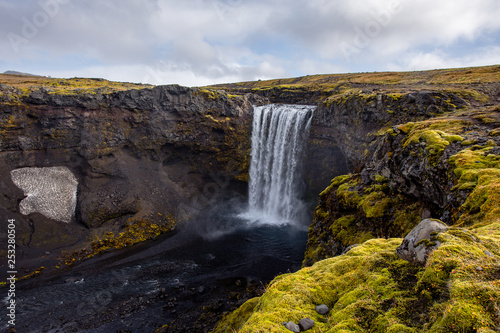 View of a waterfall in Iceland. Water flows from top to bottom. © Sergei Malkov