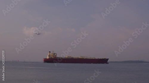 the plane flies over ship in the Changi