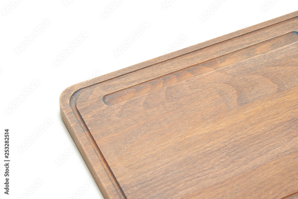 handmade cutting board of unusual shape made of wood close-up on a white background handmade cutting board of unusual shape made of wood close-up on a white background