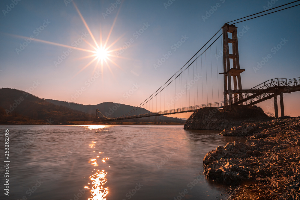 Obraz premium The longest suspension bridge in Bulgaria over Studen Kladenez dam with distance between the two towers of 260m. The only way to reach Lisicite village
