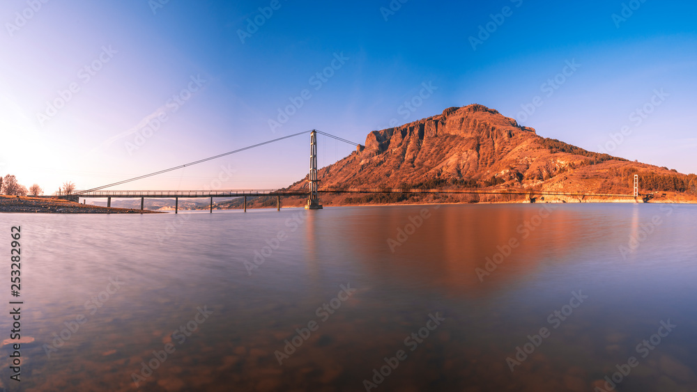 Fototapeta premium The longest suspension bridge in Bulgaria over Studen Kladenez dam with distance between the two towers of 260m. The only way to reach Lisicite village