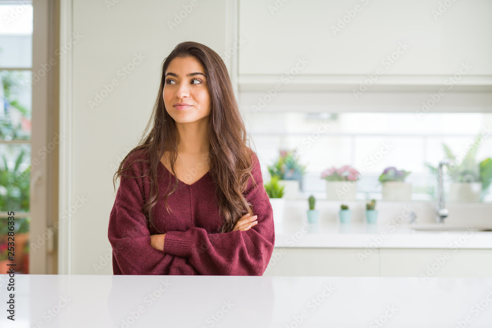 Young beautiful woman at home smiling looking side and staring away thinking. Young beautiful woman at home smiling looking side and staring away thinking.