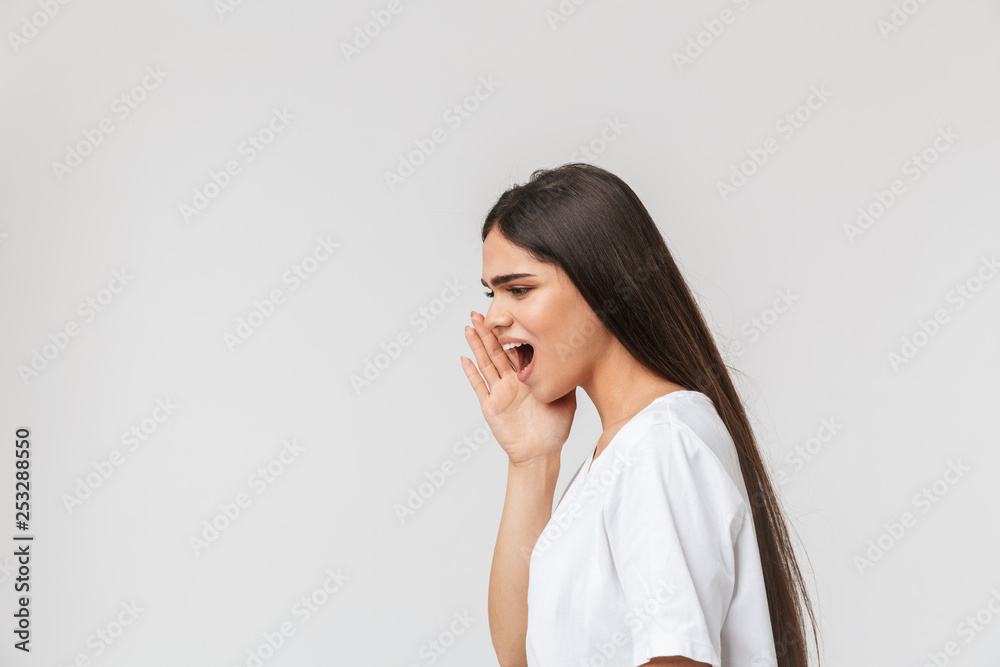 Angry young girl standing isolated over white Angry young girl standing isolated over white