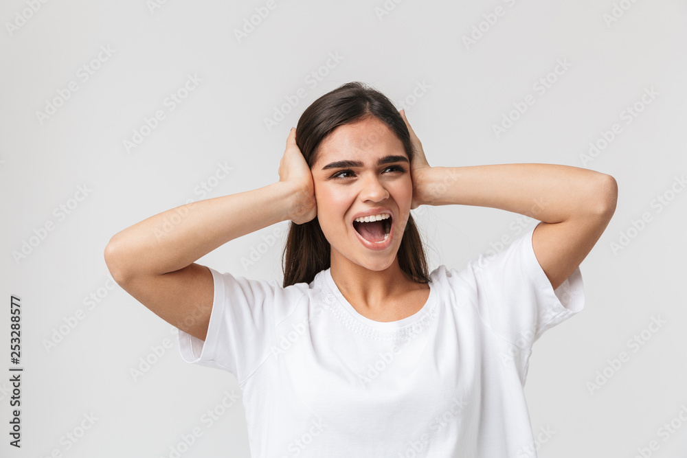 Upset young girl suffering from a headache Upset young girl suffering from a headache