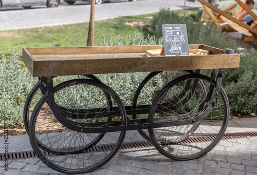 Vintage style four wheeled cart, ready to serve food