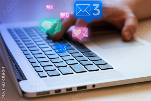 Man is using laptop with black keys, Social media and social networking. Marketing concept