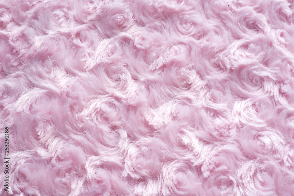 .background of pink faux fur with curls..