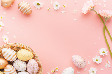Easter Flat Lay of Eggs with flowers on pink