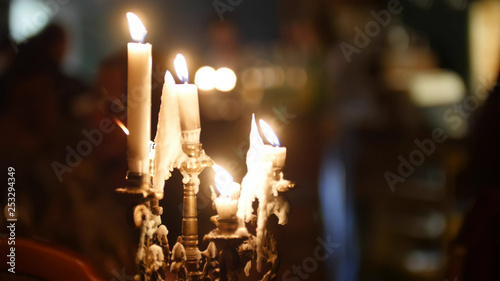 Photos White candles flaming at the restaurant. Mystical atmosphere