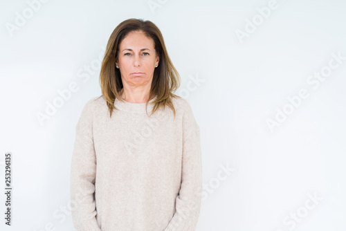 Beautiful middle age woman over isolated background depressed and worry for distress, crying angry and afraid. Sad expression. © Krakenimages.com