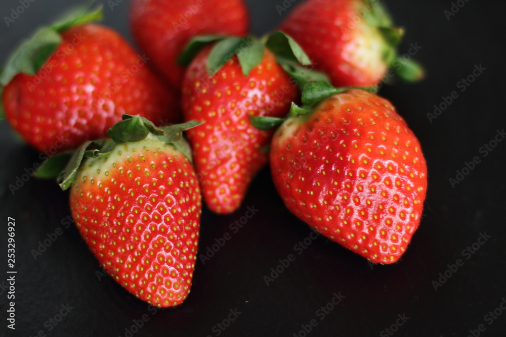 fresh red tasty sweet strawberry, on black background fresh red tasty sweet strawberry, on black background