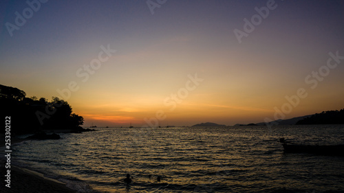 silhouette of a boat at sunset  summer beach landscape
