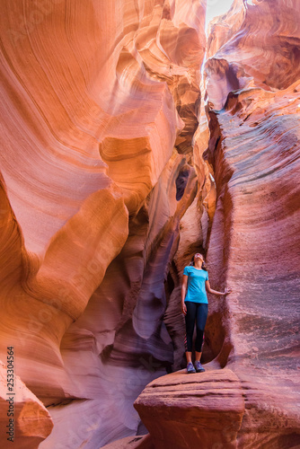 Young woman in Antelope Canyon in Arizona. Tourist in Antelope Canyon. Adventure and hiking concept.
