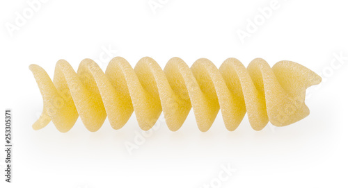 Uncooked fusilli pasta isolated on white background with clipping path