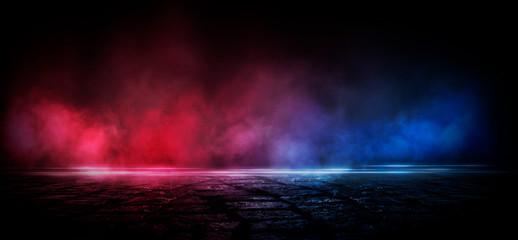Wet asphalt, reflection of neon lights, a searchlight, smoke. Abstract light in a dark empty street with smoke, smog. Dark background scene of empty street, night view, night city.