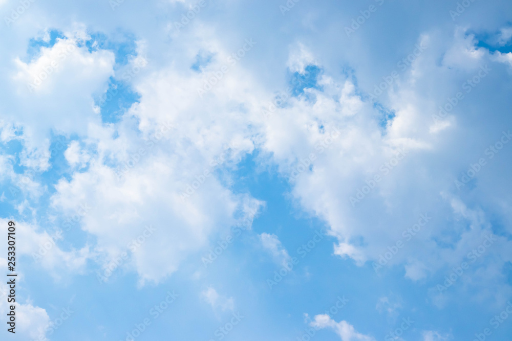 Blue sky and white clouds blue sky on a bright day with white clouds coming in floating come to cover sun causes a white beam causing beauty in the sky. Blue sky and white clouds blue sky on a bright day with white clouds coming in floating come to cover sun causes a white beam causing beauty in the sky.