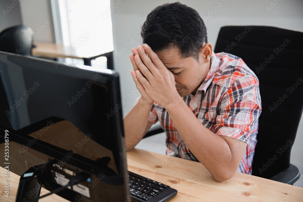 business crisis. asian man on his great depression at the office business crisis. asian man on his great depression at the office