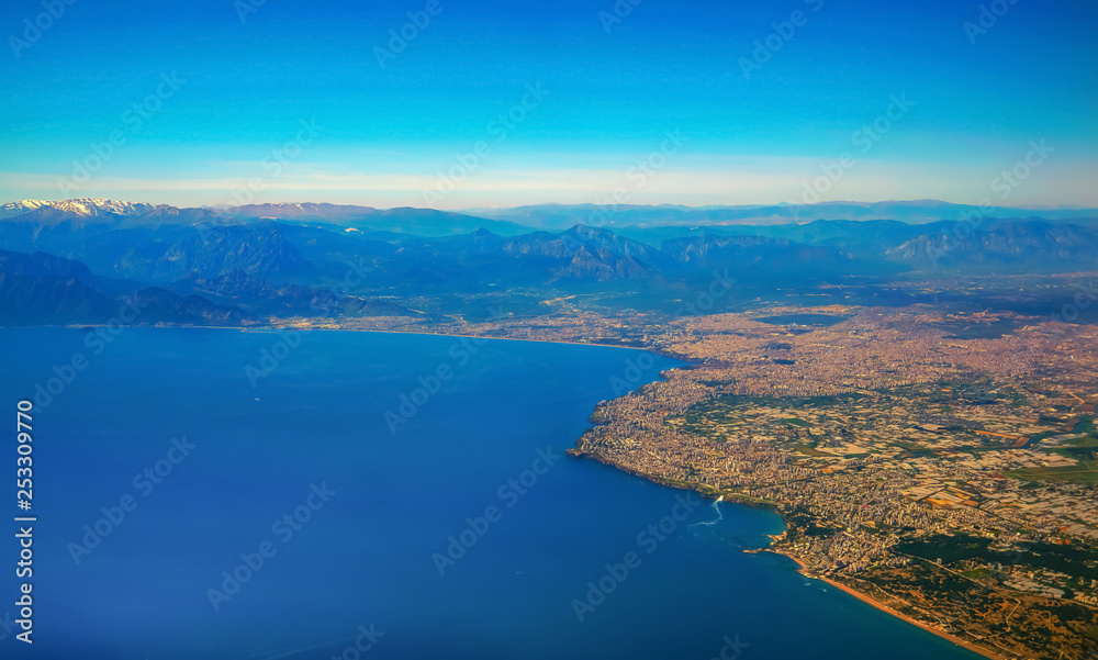 Blurred Antalya bay in Turkey from airplane windows
