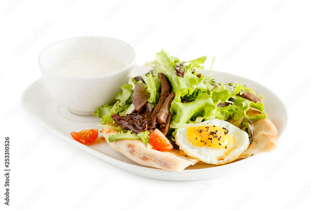 pita bread with egg, meat and green salad
