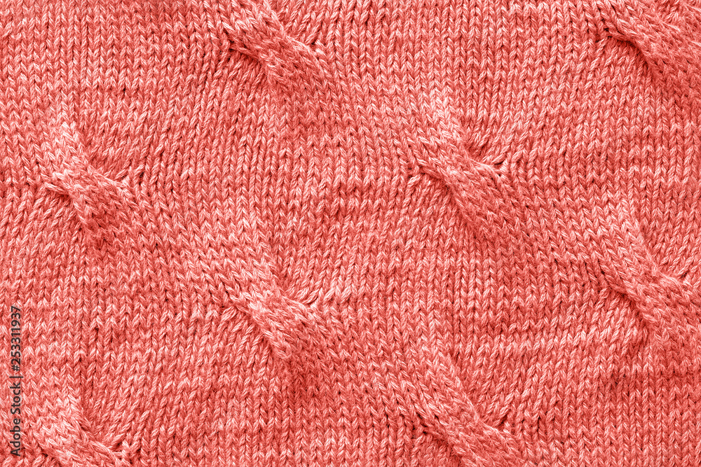 Knitted Jersey fabric textile trendy toned coral color of the year 2019, background, texture