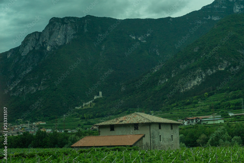 Italy,La Spezia to Kasltelruth train, a house with a mountain in the background