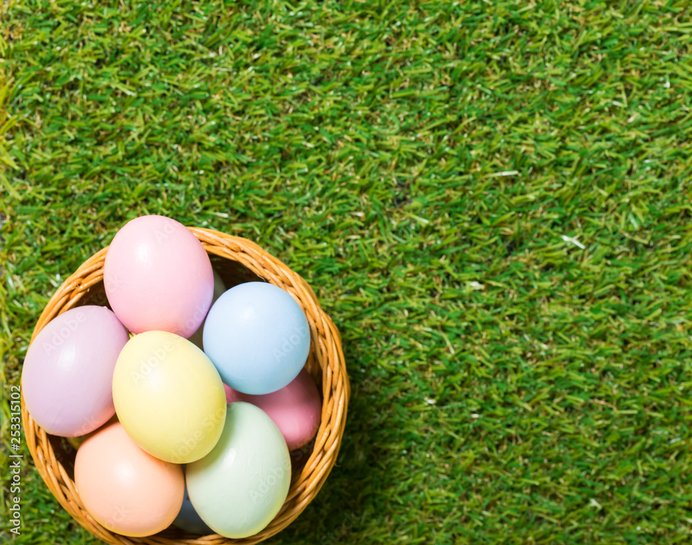 colorful easter eggs on green grass background colorful easter eggs on green grass background