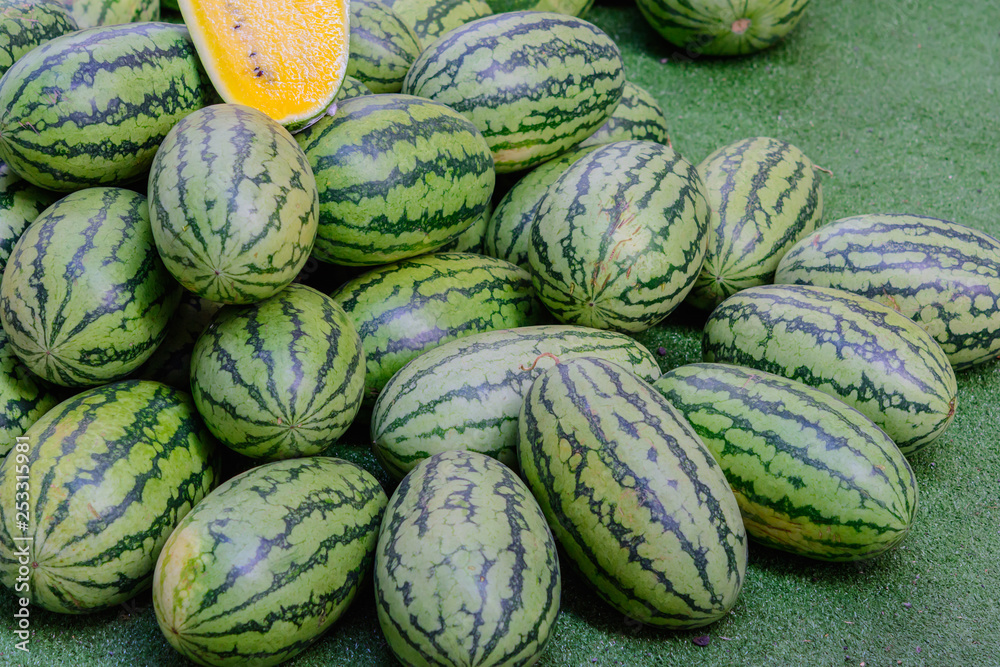 Green watermelon in a market waiting for sale. Fruit watermelon background Green watermelon in a market waiting for sale. Fruit watermelon background