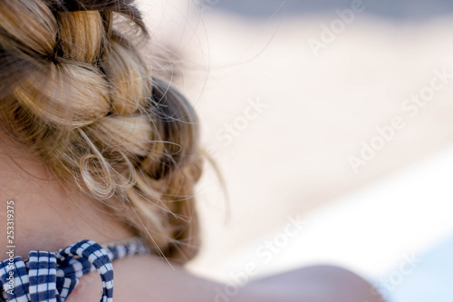 Closeup of woman blonde braided hair