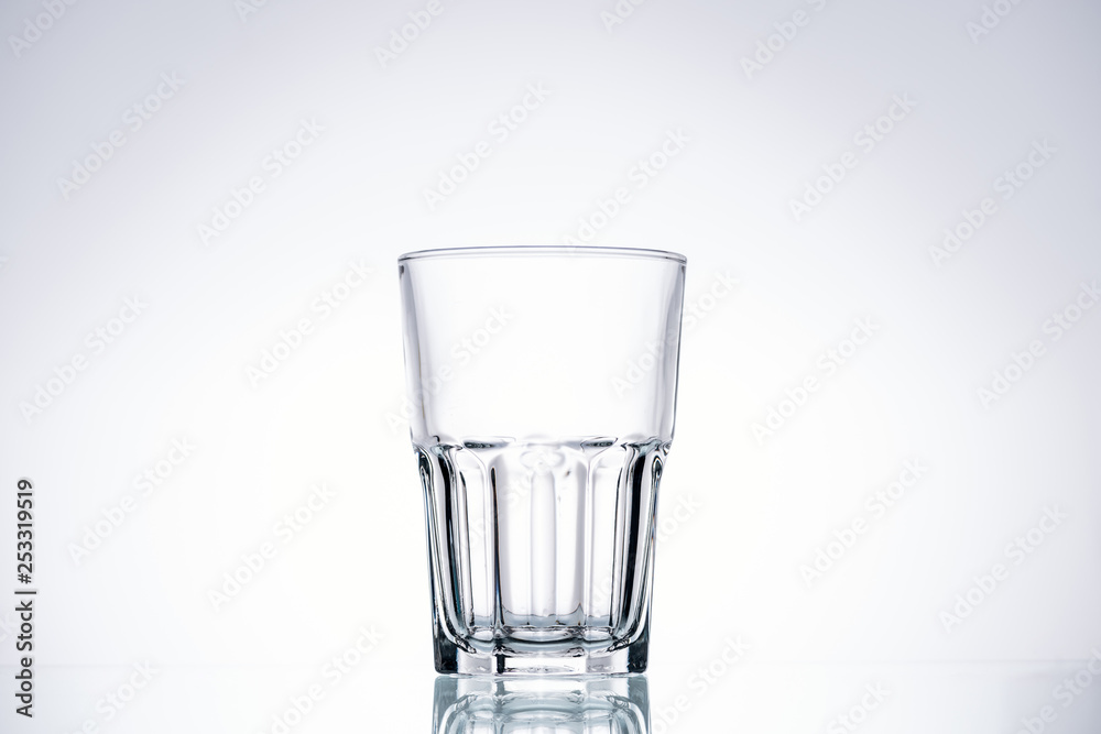 empty glass on white background with backlit and copy space empty glass on white background with backlit and copy space