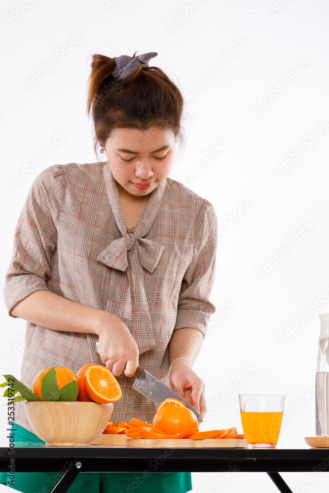 girl is learning to make fruit juicc girl is learning to make fruit juicc